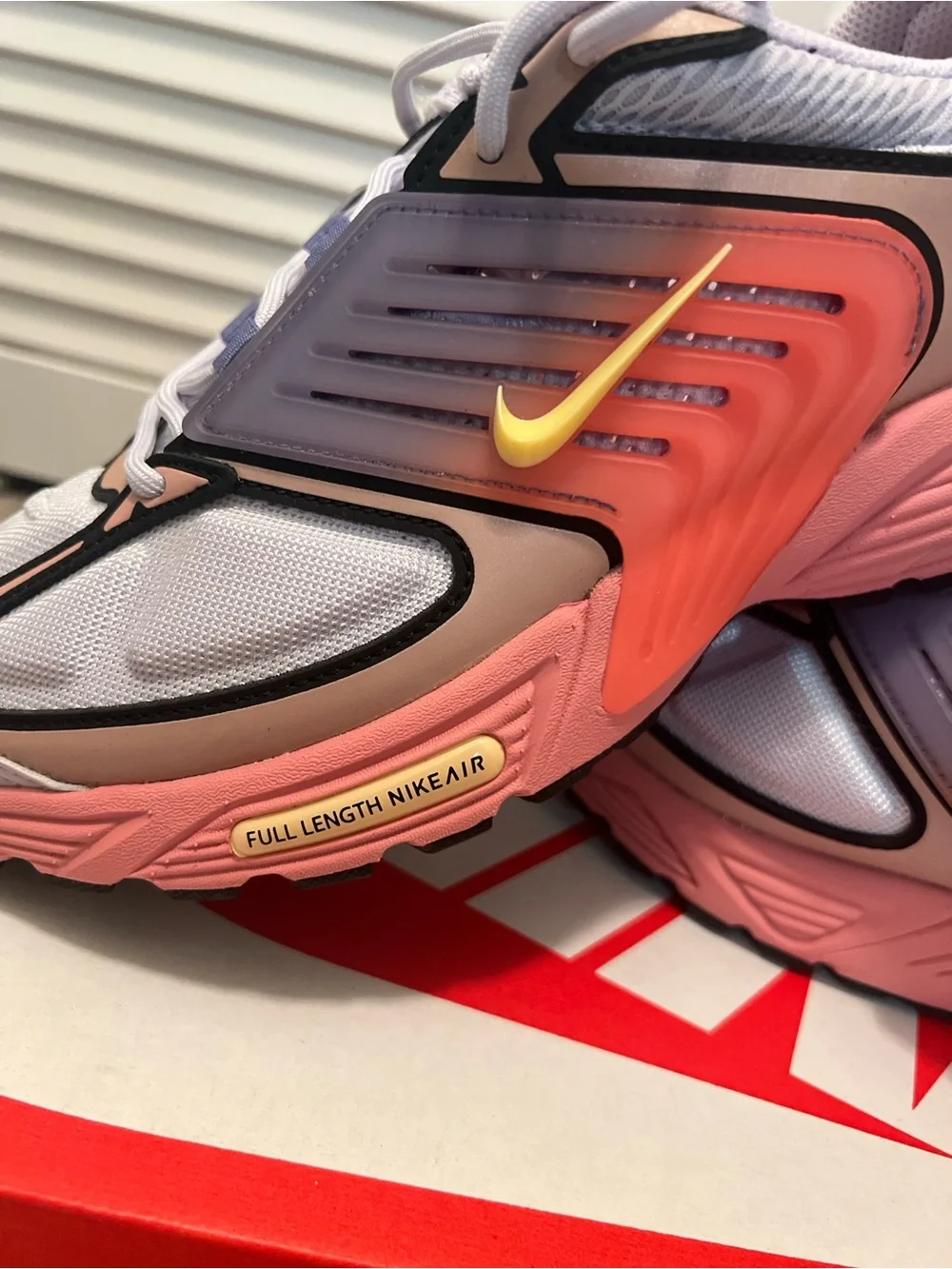 Nike men’s Pink and Gray Sneakers with Yellow Swoosh